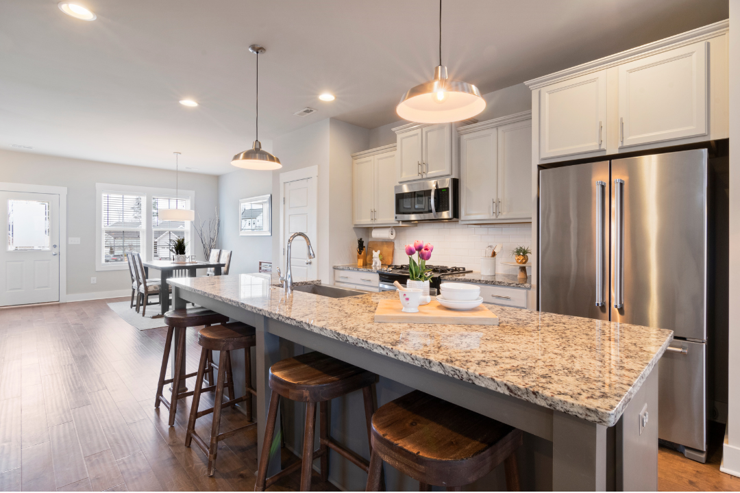 A spotless open-plan kitchen and living area in a Spring Hill, KS home